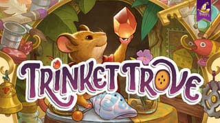 Key-Art von Trinket Trove, dem Mäuse-Sammelspiel von Mirakulus: eine Maus hält einen leuchtenden Edelstein zwischen vielen Schmuckstücken, daneben das Spiellogo.